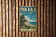 A vintage-style metal sign for Point Beach State Forest in Wisconsin, featuring a scenic landscape with pine trees, a beach, and a bird in flight.