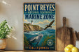 A vintage-style sign for Point Reyes National Seashore Marine Zone in California, featuring a lighthouse, seal, and bird in the ocean.