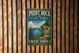 A vintage-style metal sign for Point Rock State Forest, featuring a scenic landscape with a cliff overlooking a lake and pine trees.
