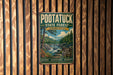 A vintage metal sign for the Pootatuck State Forest in Connecticut, featuring a scenic illustration of a forest and a waterfall.