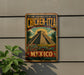 A vintage-style sign for Chichen Itza, the pre-hispanic city of Mexico, featuring a pyramid and a dragon.