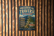 A vintage-style metal sign advertising the Presidential Traverse in New Hampshire, featuring a mountain landscape and directional signs.