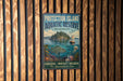A vintage-style metal sign for the Protection Island Aquatic Reserve in Washington, featuring an illustration of a seascape with a lighthouse, fish, and marine life.