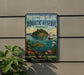 A vintage-style metal sign for the Protection Island Aquatic Reserve in Washington, featuring an illustration of a fish, a boat, and marine life.