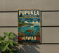 A vintage metal sign for the Pupukea Marine Life Conservation District in Hawaii, featuring a turtle swimming in the ocean and tropical flowers.