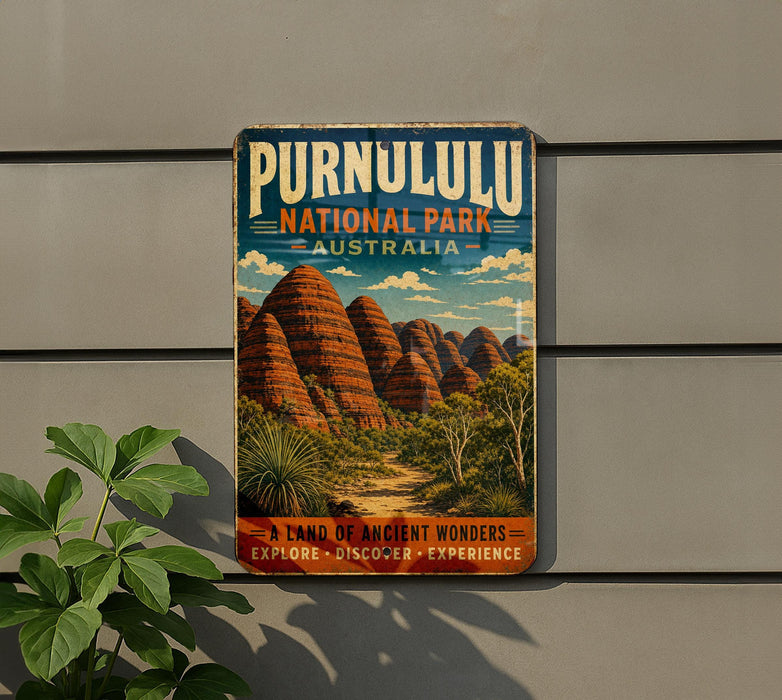 A vintage-style sign for Purnululu National Park in Australia, featuring a scenic illustration of the iconic rock formations.
