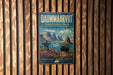 A vintage metal sign for the Northern Territory Park in Nunavut, Canada, featuring a scenic landscape with mountains, a moose, and a frozen lake.