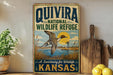 a vintage-style sign for the Quivira National Wildlife Refuge in Kansas, with a duck illustration and a sunset in the background.