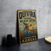 A vintage-style sign for the Quivira National Wildlife Refuge in Kansas, featuring a duck in flight and a sunset landscape.
