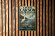 a vintage-style metal sign with a bird illustration, mounted on a wooden wall.