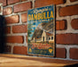 A vintage metal sign with the text "Rangiri Dambulla Cave Temple" and "Sri Lanka" hangs on a brick wall.