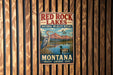 A vintage-style metal sign for the Red Rock Lakes National Wildlife Refuge in Montana, featuring an illustration of a bird and a lake surrounded by mountains.