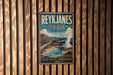 A vintage-style metal sign for Reykjanes Park, Iceland, featuring a scenic landscape with a volcano and a lighthouse.