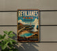 A vintage-style sign for Reykjanes Park, Iceland, featuring a scenic landscape with a lighthouse and a hot spring.
