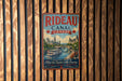 A vintage metal sign for Rideau Canal, Canada, featuring a scenic illustration of the canal and historic buildings.