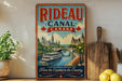 A vintage-style poster advertising Rideau Canal, Canada, featuring a scenic illustration of the canal and historic buildings.