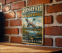 A vintage-style metal sign for the Ridgefield National Wildlife Refuge, featuring a duck in flight and a scenic landscape.