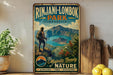 A vintage-style sign for Rinjani-Lombok Park in Indonesia, featuring a hiker standing on a cliff overlooking a scenic landscape.
