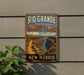 A vintage-style metal sign for the Rio Grande Gorge Trail in New Mexico, featuring a scenic image of the canyon landscape.