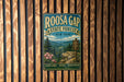 A vintage-style metal sign for Roosa Gap State Forest in New York, featuring a scenic mountain landscape and a sign indicating the location of the forest.