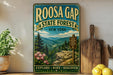 a vintage-style metal sign for Roosa Gap State Forest in New York, with a scenic mountain landscape and pine trees. The sign also includes the words "Explore, Hike, Discover" and a trail marker sign.