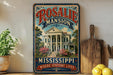 A vintage-style sign for Rosalie Mansion, a historic home in Mississippi, with a large illustration of the mansion and surrounding landscape.