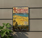 A vintage metal sign displaying the routes of Santaíago de Compostela, with a map and text indicating the journey to the city.