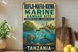 a vintage-style sign advertising the Rufiji-Mafia-Kilwa Marine Ramasar Site in Tanzania, with a tropical beach scene and various marine life depicted.