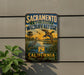 A vintage-style sign for the Sacramento National Wildlife Refuge in California, featuring illustrations of birds and a scenic landscape.