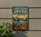 A vintage-style sign for the Sacramento-San Joaquin Delta National Heritage Area, featuring illustrations of a river, a steamboat, and a bird.