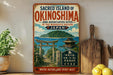 a vintage-style sign for the Sacred Island of Okinawa, Japan, with a scenic illustration of a traditional Japanese temple and a serene ocean view.