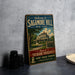 A vintage-style sign welcoming visitors to Sagamore Hill, New York, featuring an illustration of a house and the text "Welcome to Sagamore Hill" and "Home of Theodore Roosevelt".
