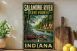 A vintage-style metal sign for the Salamonie River State Forest in Indiana, featuring a canoe on a river surrounded by trees and mountains.