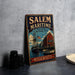 A vintage metal sign for Salem Maritime National Historic Site in Massachusetts, featuring an illustration of a ship and a building.