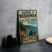 A vintage-style metal sign for the State Scenic Corridor in Oregon, featuring a scenic coastal landscape with mountains, trees, and the ocean.