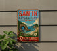 A vintage metal sign advertising San'In Kaigan Park, Japan, featuring a scenic landscape with a rocky arch, blue sky, and ocean.