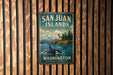A vintage metal sign for San Juan Islands, Washington, featuring an image of a whale and a lighthouse on a wooden background.