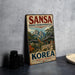 A vintage metal sign advertising the "Sansa Buddhist Mountain Monasteries" in South Korea, featuring a scenic mountain landscape and traditional Korean architecture.