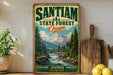 A vintage-style sign for the Santiam State Forest in Oregon, featuring a scenic mountain landscape with a waterfall.