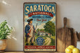 A vintage-style sign for Saratoga National Historical Park in New York, featuring a man in a military uniform and a historical scene.