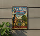 A vintage-style metal sign for Saratoga National Historical Park in New York, featuring a historical figure in a uniform and a scenic landscape.