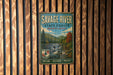 A vintage metal sign for Savage River State Forest in Maryland, featuring a scenic image of a waterfall and forest.
