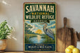 A vintage-style sign for the Savannah National Wildlife Refuge in Georgia, featuring an illustration of a bird and a serene landscape.