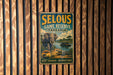 A vintage metal sign advertising the Selous Game Reserve in Tanzania, featuring an illustration of an elephant and a boat on a river.