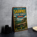 A vintage-style sign for Shawnee State Forest in Ohio, featuring a scenic illustration of the forest landscape.