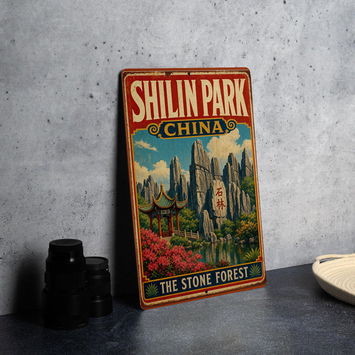 A vintage-style metal sign for Shilin Park, China, featuring a scenic landscape with mountains, pagodas, and a stone forest.