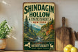 A vintage-style metal sign for Shindagin Hollow State Forest in New York, featuring a scenic image of a forest with a river and mountains.