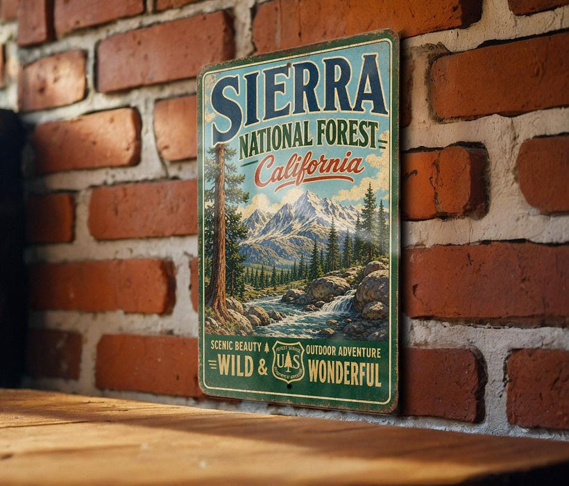 A vintage-style metal sign for Sierra National Forest in California, featuring a scenic mountain landscape and the text "Sierra National Forest California" prominently displayed.
