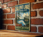A vintage-style metal sign for Silent Lake Provincial Park in Ontario, featuring a scenic landscape with a lake, trees, and a canoe.