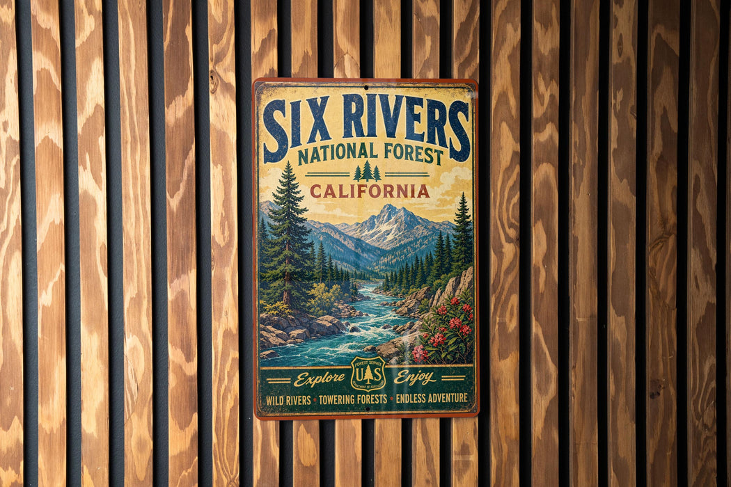 A vintage metal sign for the Six Rivers National Forest in California, featuring a scenic mountain landscape with a river flowing through it.